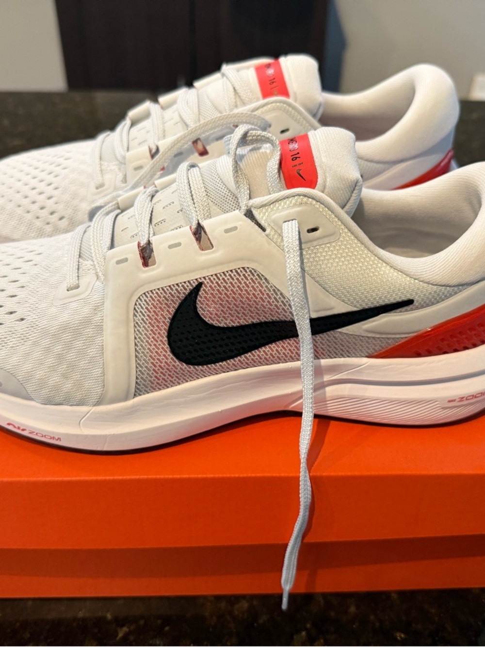 Nike Men's White Athletic Running Shoes with Black Swoosh and Red Accents